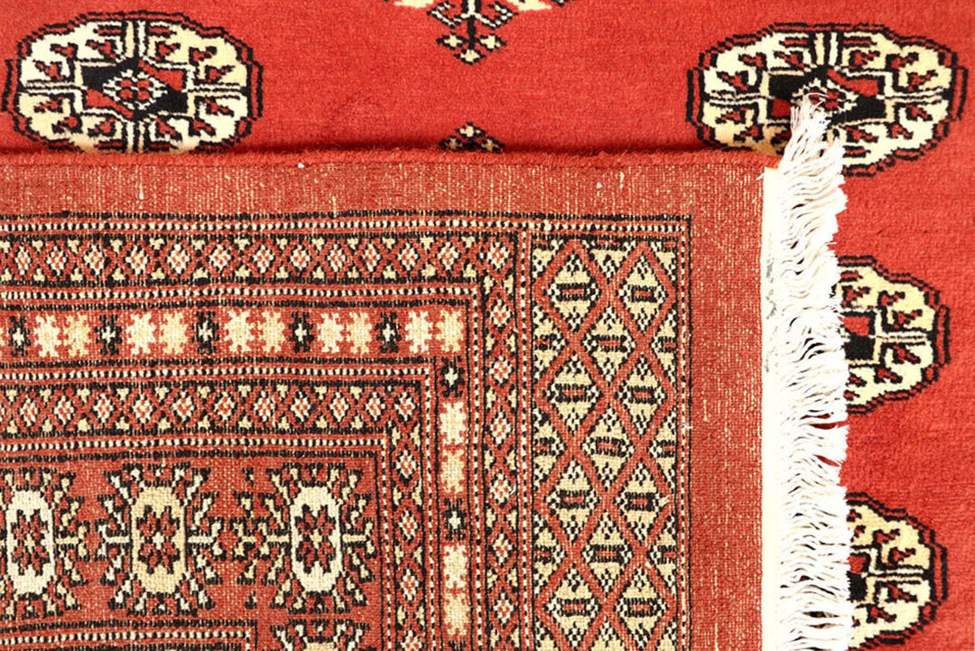 Coral Pakistani Bokhara Rug 6' 2" x 8' 10" Hand-Knotted | No. QA66791