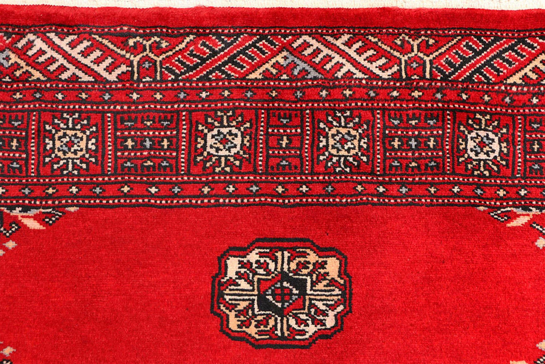 Red Pakistani Bokhara Rug 3' 1" x 5' 7" Hand-Knotted | No. QA68637