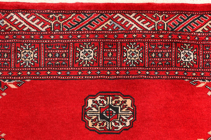 Red Pakistani Bokhara Rug 3' 1" x 5' 7" Hand-Knotted | No. QA68637