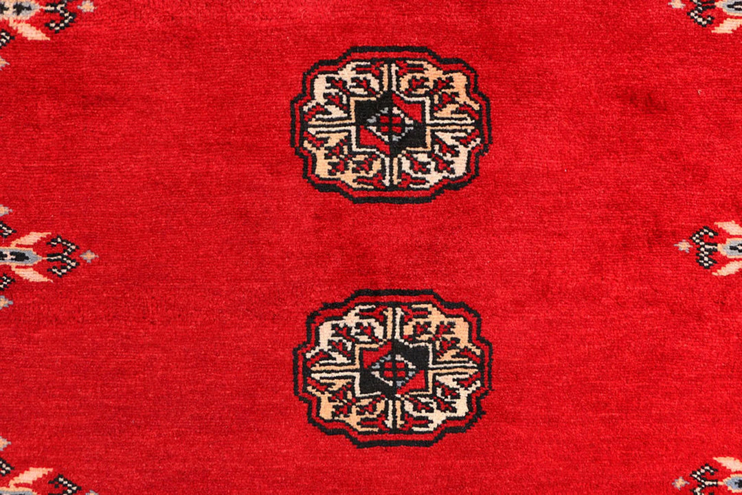 Red Pakistani Bokhara Rug 3' 1" x 5' 7" Hand-Knotted | No. QA68637