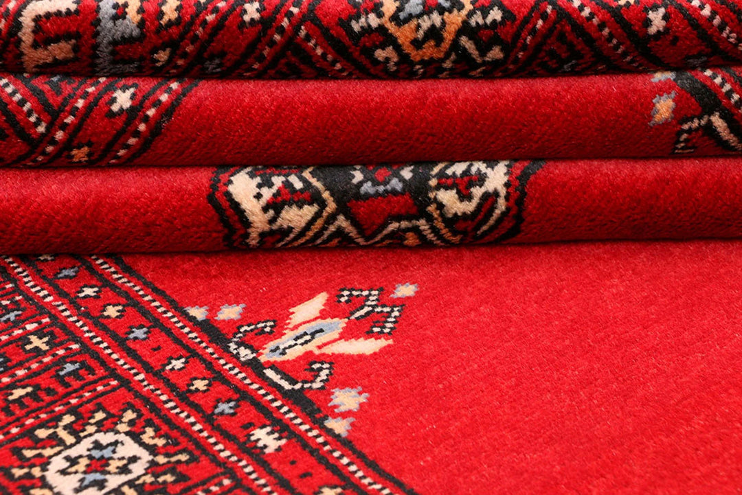 Red Pakistani Bokhara Rug 3' 1" x 5' 7" Hand-Knotted | No. QA68637