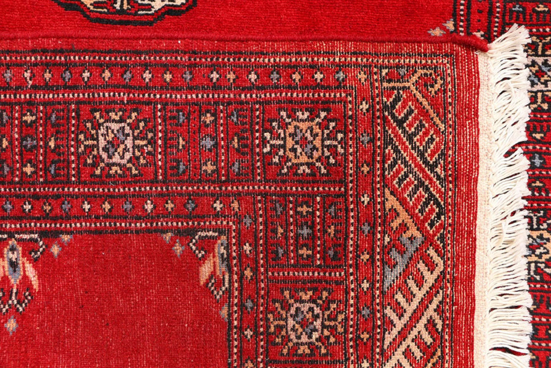 Red Pakistani Bokhara Rug 3' 1" x 5' 7" Hand-Knotted | No. QA68637