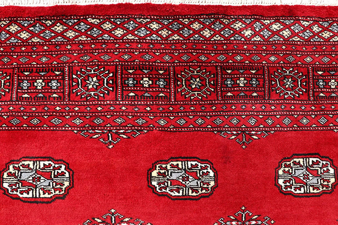 Firebrick Pakistani Bokhara Rug 5' 5" x 8' 11" Hand-Knotted | No. QA68866