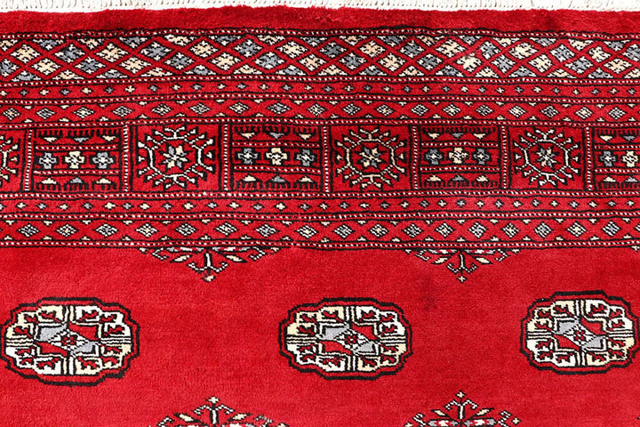 Firebrick Pakistani Bokhara Rug 5' 5" x 8' 11" Hand-Knotted | No. QA68866