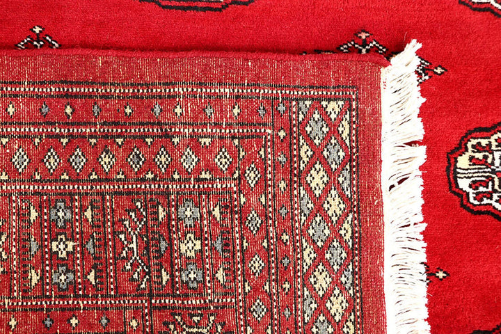 Firebrick Pakistani Bokhara Rug 5' 5" x 8' 11" Hand-Knotted | No. QA68866