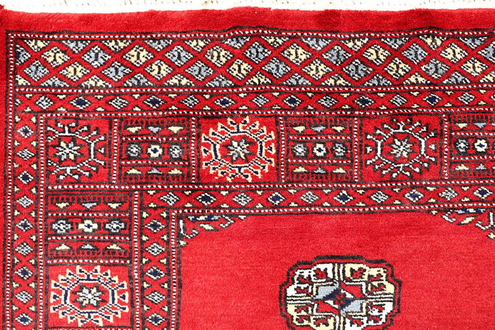 Red Pakistani Bokhara Rug 4' 1" x 6' 2" Hand-Knotted | No. QA69058