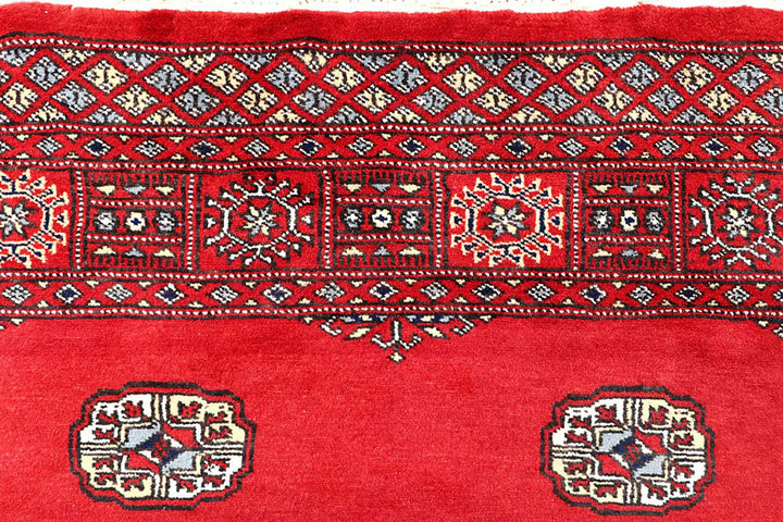Red Pakistani Bokhara Rug 4' 1" x 6' 2" Hand-Knotted | No. QA69058