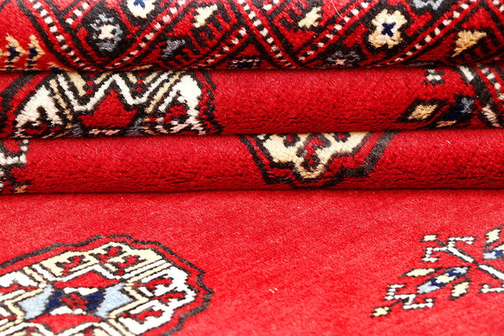 Red Pakistani Bokhara Rug 4' 1" x 6' 2" Hand-Knotted | No. QA69058