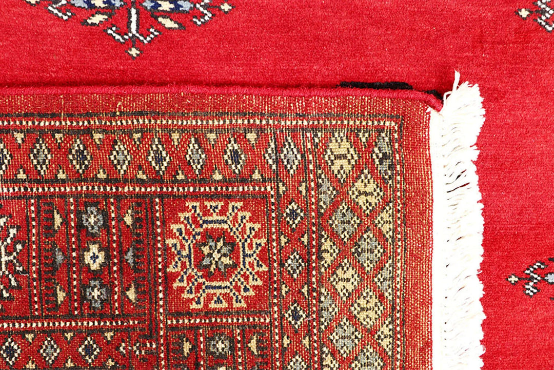 Red Pakistani Bokhara Rug 4' 1" x 6' 2" Hand-Knotted | No. QA69058
