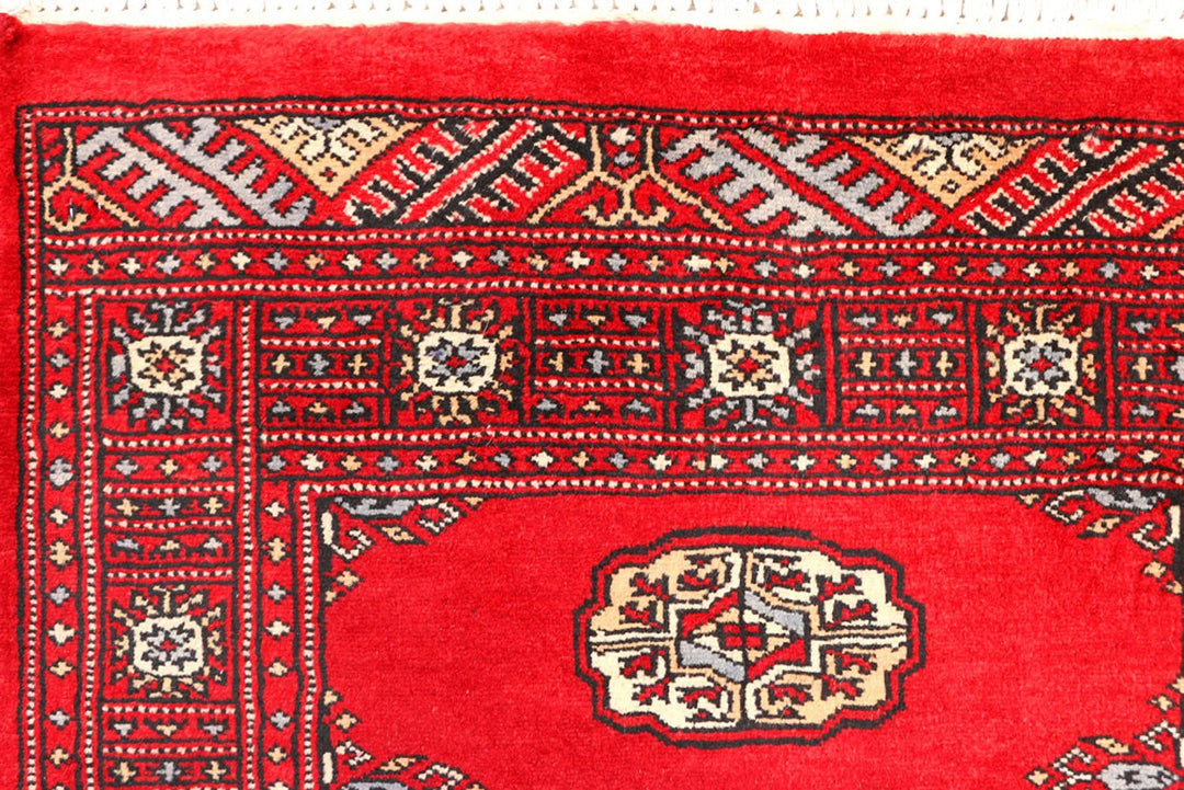 Red Pakistani Bokhara Rug 2' 6" x 6' 3" Hand-Knotted | No. QA69479