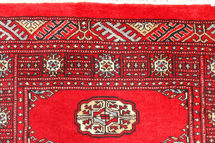 Red Pakistani Bokhara Rug 2' 6" x 6' 3" Hand-Knotted | No. QA69479