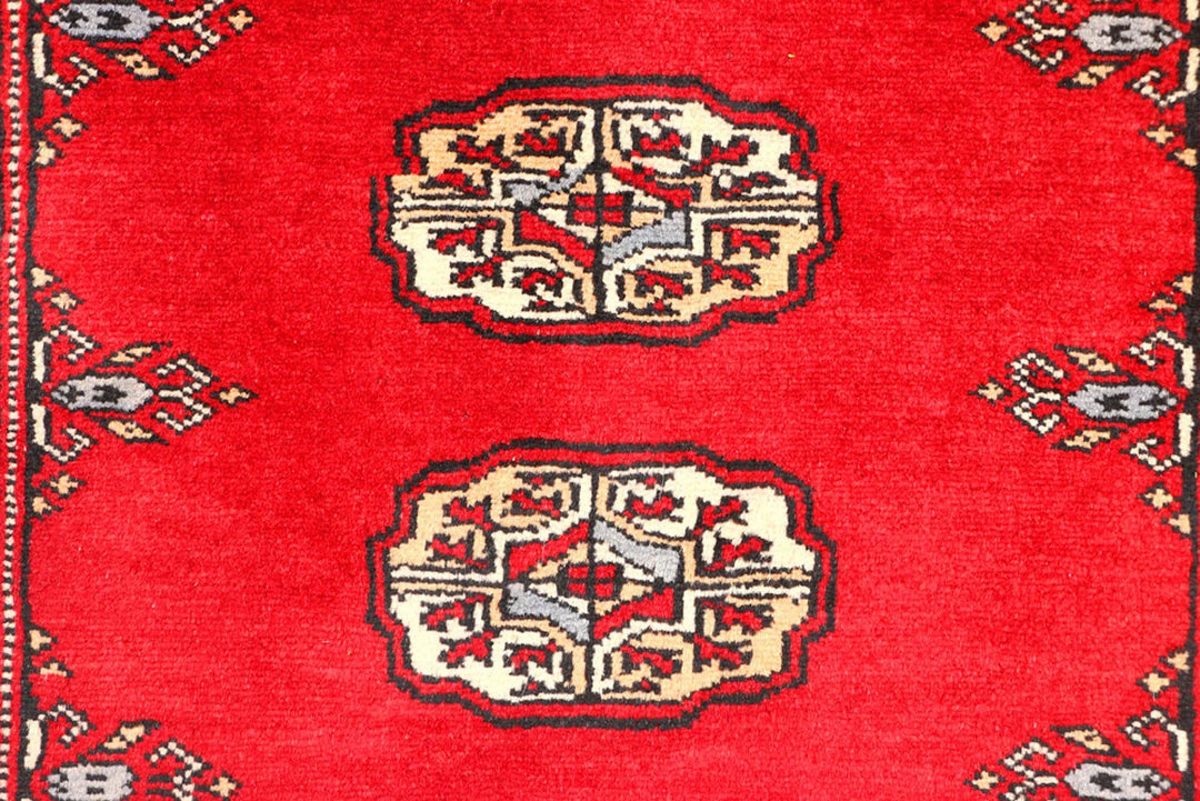 Red Pakistani Bokhara Rug 2' 6" x 6' 3" Hand-Knotted | No. QA69479