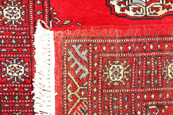 Red Pakistani Bokhara Rug 2' 6" x 6' 3" Hand-Knotted | No. QA69479