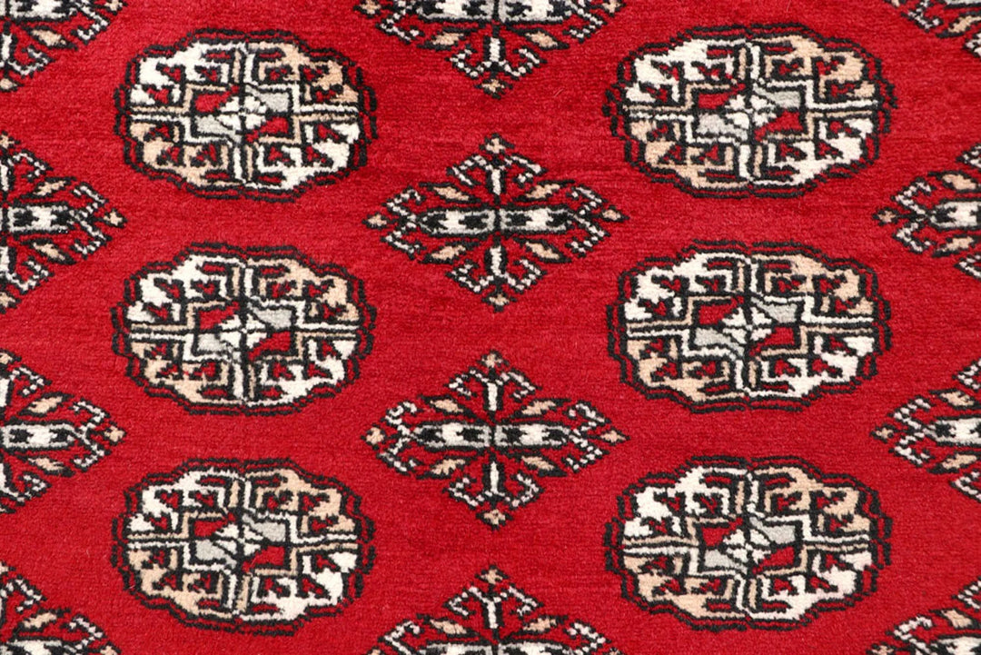 Red Pakistani Bokhara Rug 5' 2" x 7' 3" Hand-Knotted | No. QA69612