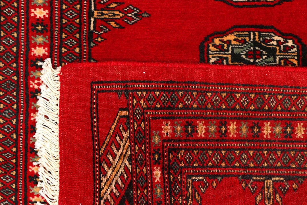 Red Pakistani Bokhara Rug 2' 7" x 9' 2" Hand-Knotted | No. QA70426