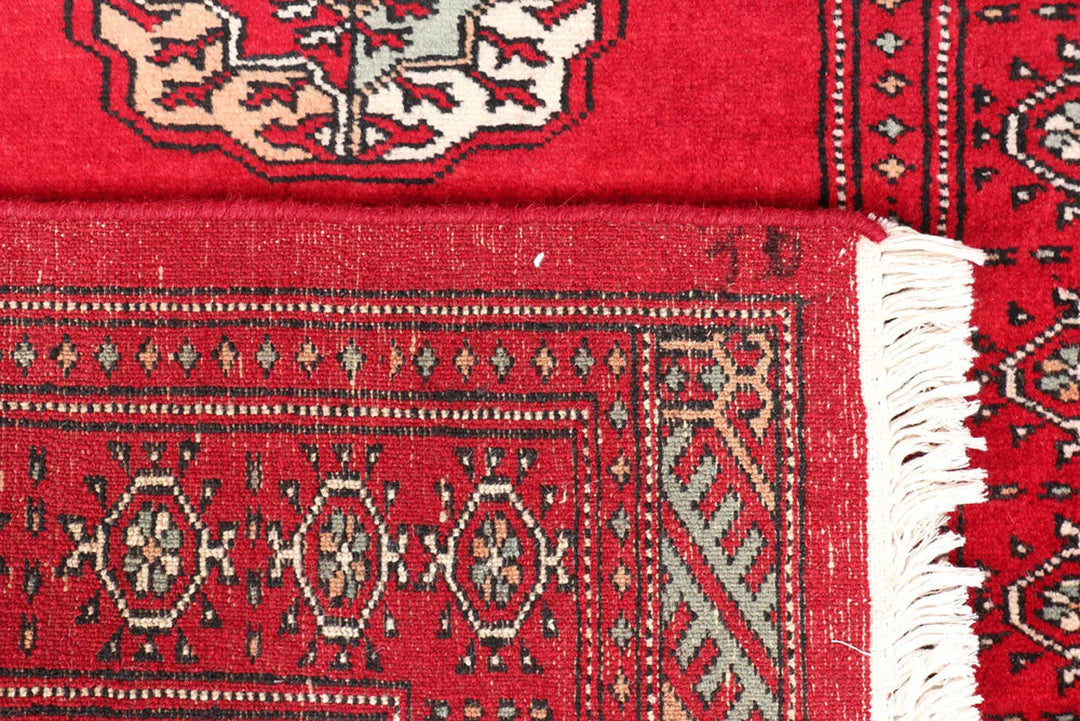 Dark Red Pakistani Bokhara Rug 2' 7" x 10' 6" Hand-Knotted | No. QA72719