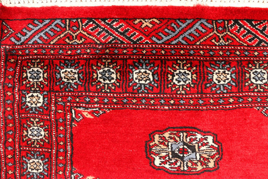 Red Pakistani Bokhara Rug 2' 6" x 9' 5" Hand-Knotted | No. QA72992