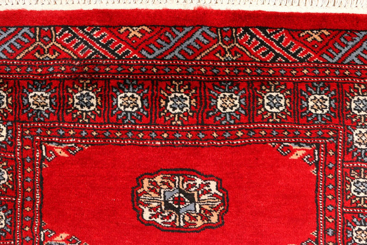 Red Pakistani Bokhara Rug 2' 6" x 9' 5" Hand-Knotted | No. QA72992