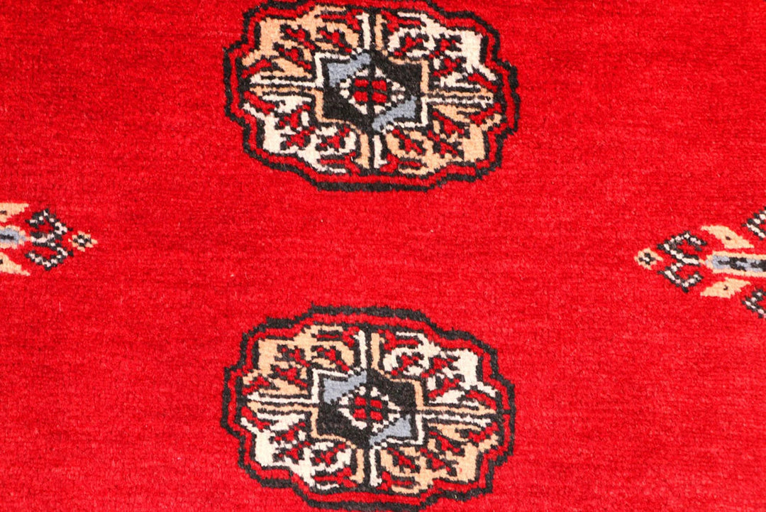 Red Pakistani Bokhara Rug 2' 6" x 9' 5" Hand-Knotted | No. QA72992