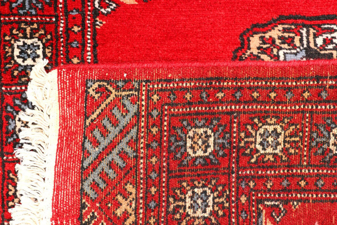 Red Pakistani Bokhara Rug 2' 6" x 9' 5" Hand-Knotted | No. QA72992