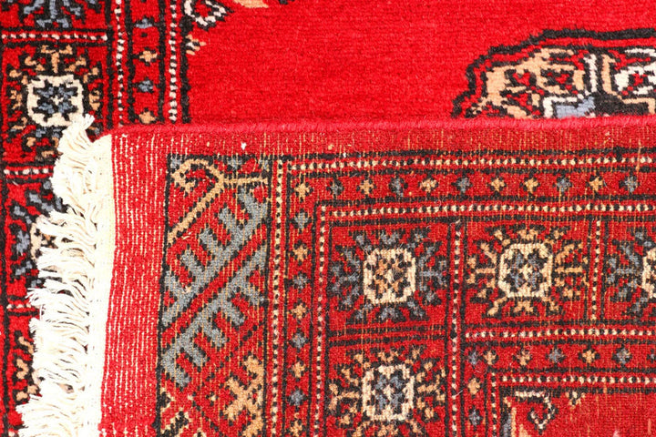 Red Pakistani Bokhara Rug 2' 6" x 9' 5" Hand-Knotted | No. QA72992