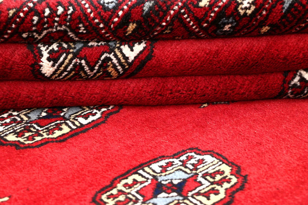 Red Pakistani Bokhara Rug 4' 2" x 6' 9" Hand-Knotted | No. QA73256
