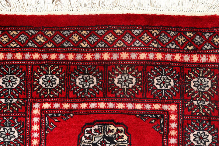 Red Pakistani Bokhara Rug 2' 6" x 9' 4" Hand-Knotted | No. QA73641