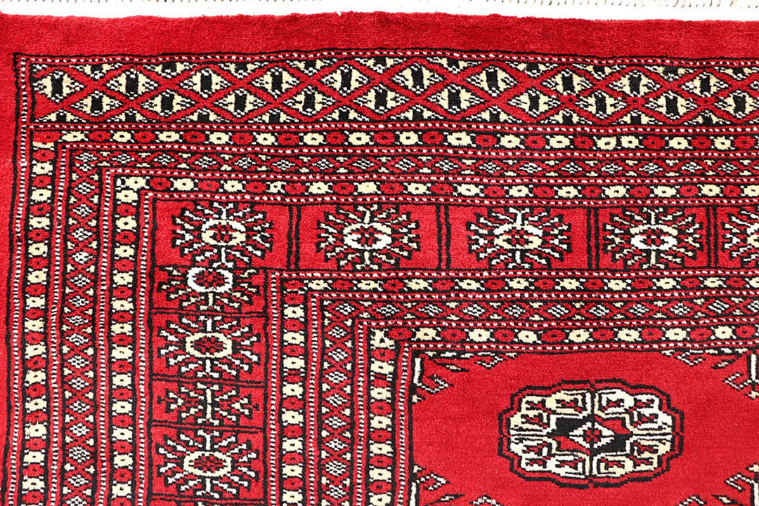 Red Pakistani Bokhara Rug 5' 6" x 8' 4" Hand-Knotted | No. QA73765