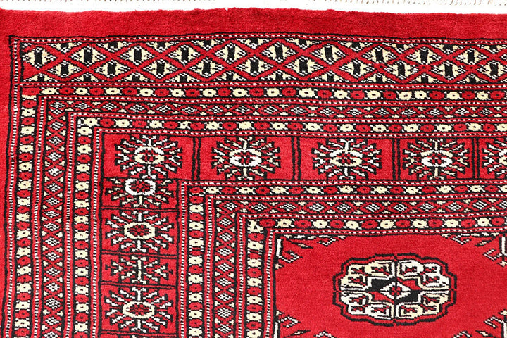 Red Pakistani Bokhara Rug 5' 6" x 8' 4" Hand-Knotted | No. QA73765