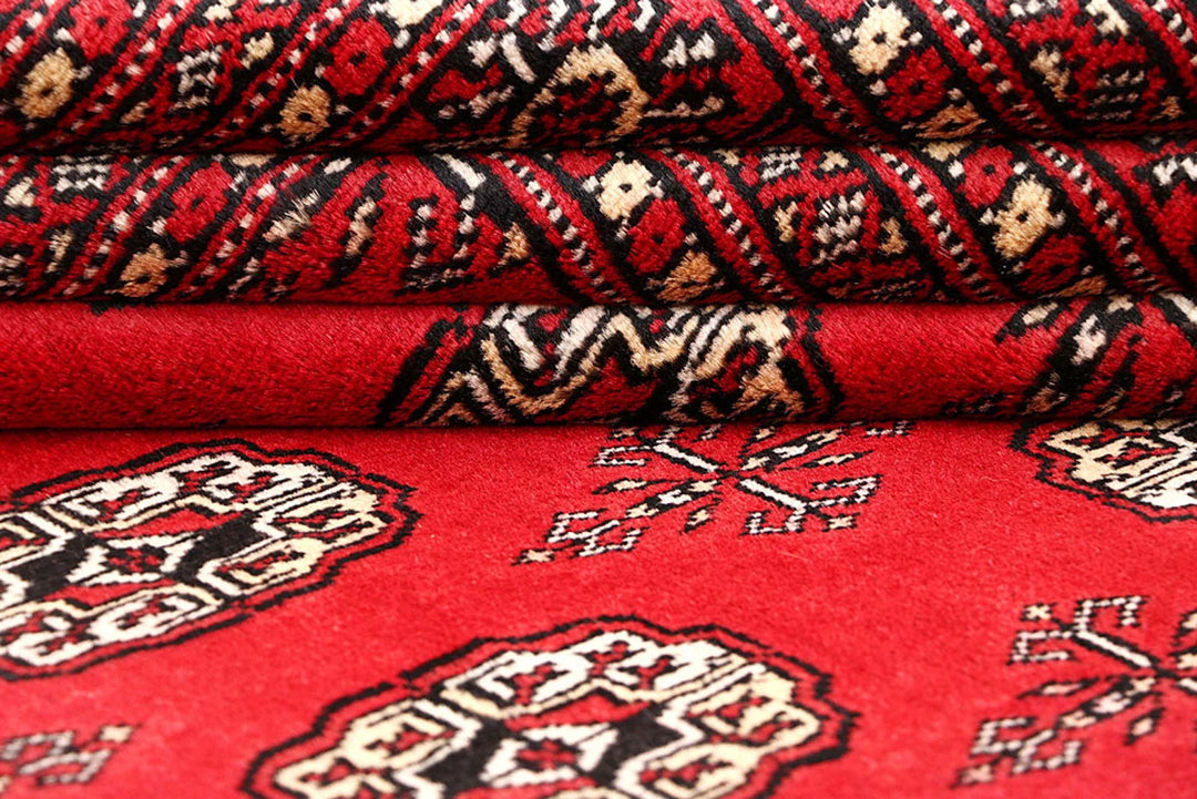 Red Pakistani Bokhara Rug 5' 6" x 8' 4" Hand-Knotted | No. QA73765