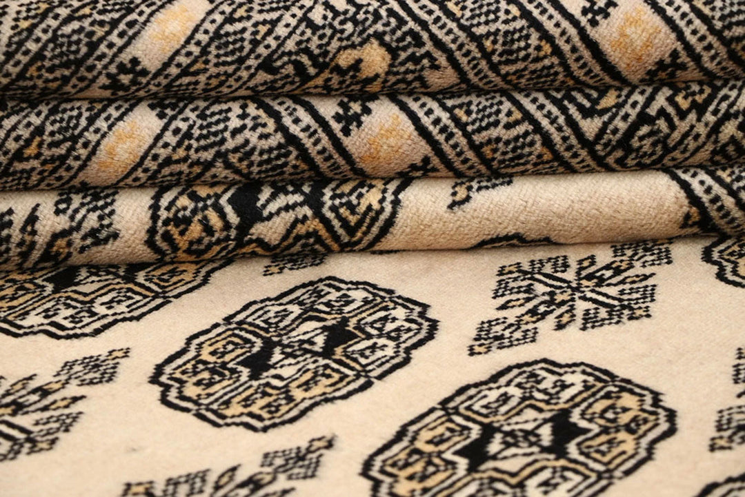 Bisque Pakistani Bokhara Rug 6' 1" x 9' 1" Hand-Knotted | No. QA74268