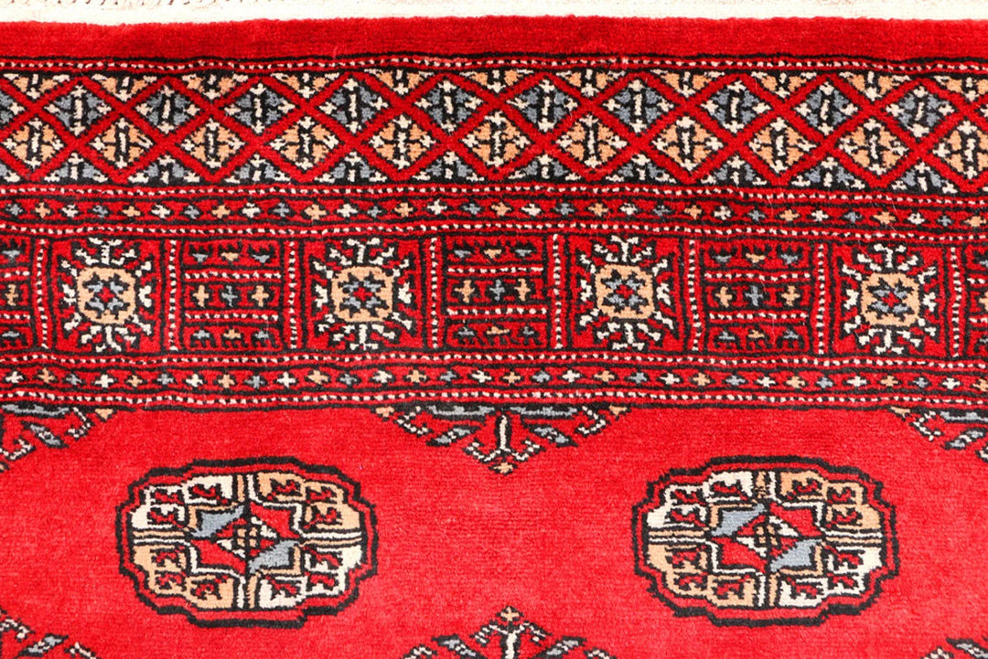 Red Pakistani Bokhara Rug 3' 1" x 5' 5" Hand-Knotted | No. QA75026