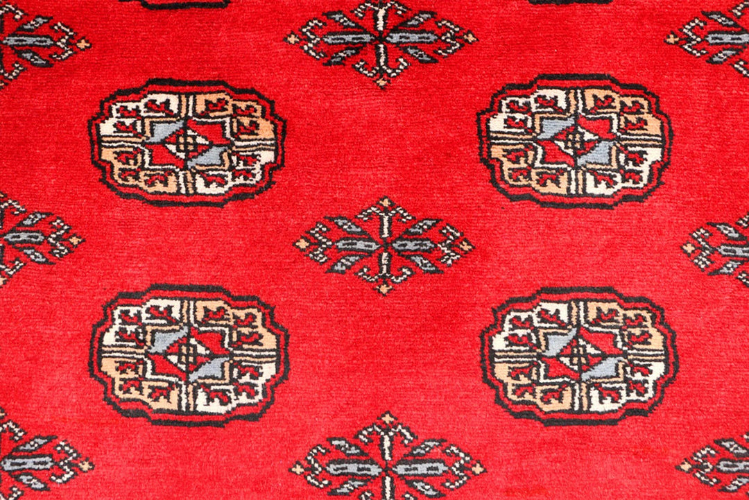Red Pakistani Bokhara Rug 3' 1" x 5' 5" Hand-Knotted | No. QA75026