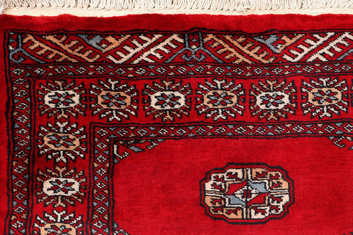 Red Pakistani Bokhara Rug 2' 6" x 10' 3" Hand-Knotted | No. QA76132
