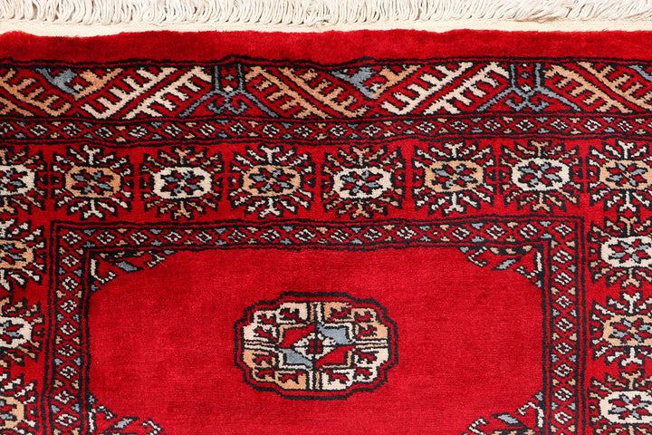 Red Pakistani Bokhara Rug 2' 6" x 10' 3" Hand-Knotted | No. QA76132