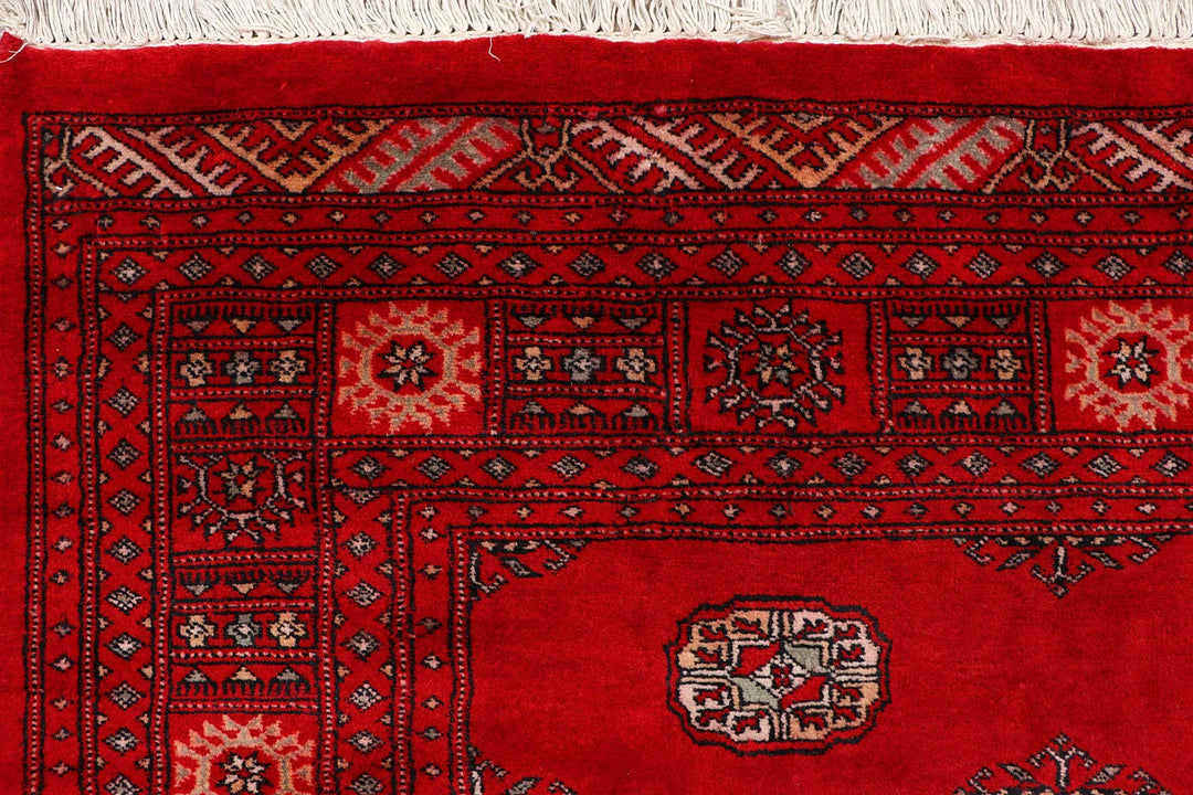Red Pakistani Bokhara Rug 4' 6" x 6' 8" Hand-Knotted | No. QA76639