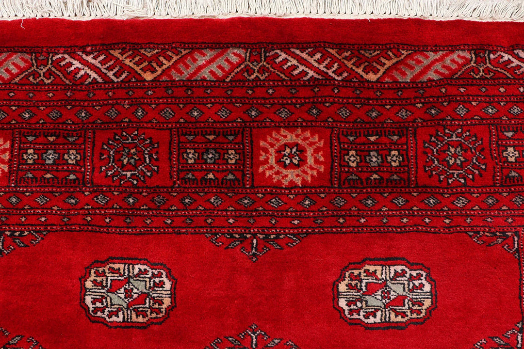 Red Pakistani Bokhara Rug 4' 6" x 6' 8" Hand-Knotted | No. QA76639