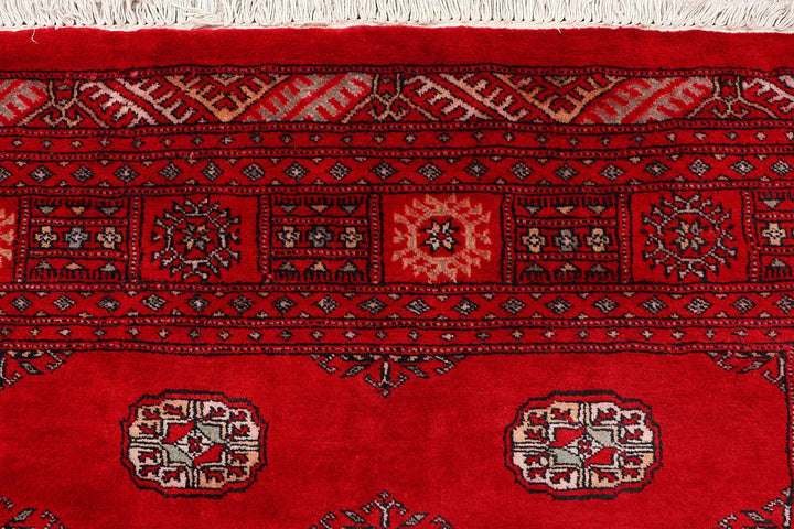 Red Pakistani Bokhara Rug 4' 6" x 6' 8" Hand-Knotted | No. QA76639