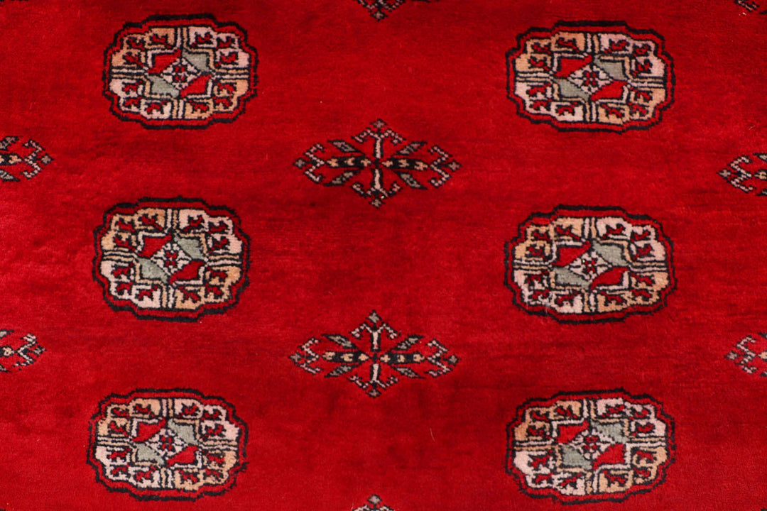 Red Pakistani Bokhara Rug 4' 6" x 6' 8" Hand-Knotted | No. QA76639