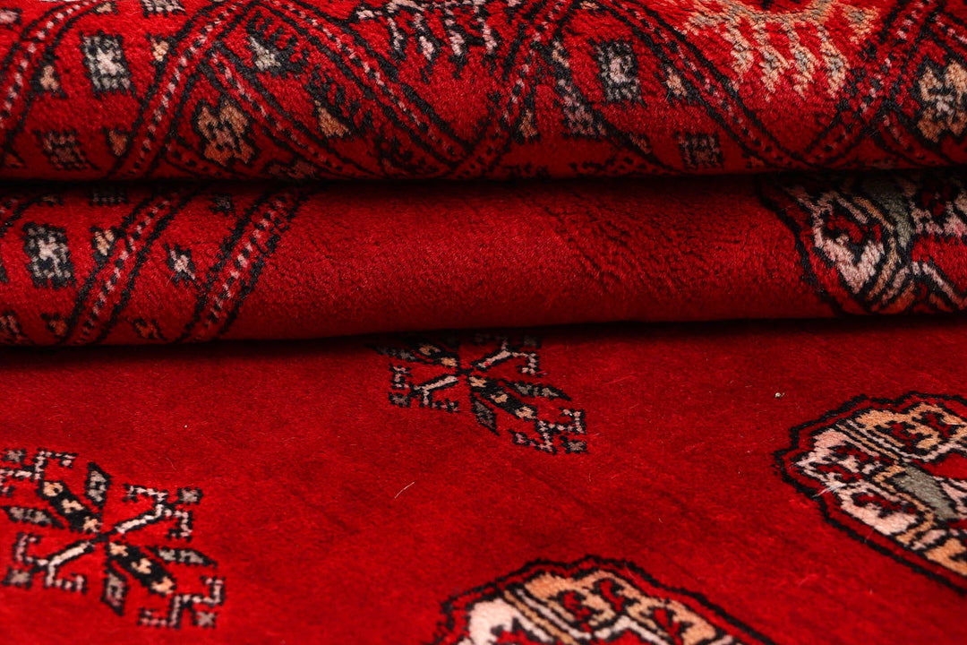 Red Pakistani Bokhara Rug 4' 6" x 6' 8" Hand-Knotted | No. QA76639