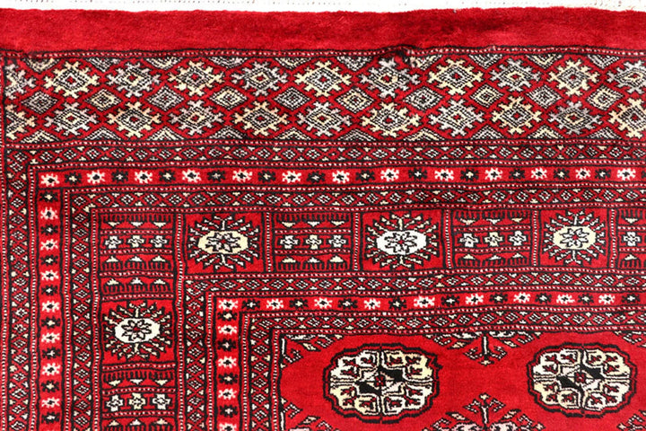 Red Pakistani Bokhara Rug 6' 1" x 9' 2" Hand-Knotted | No. QA77231