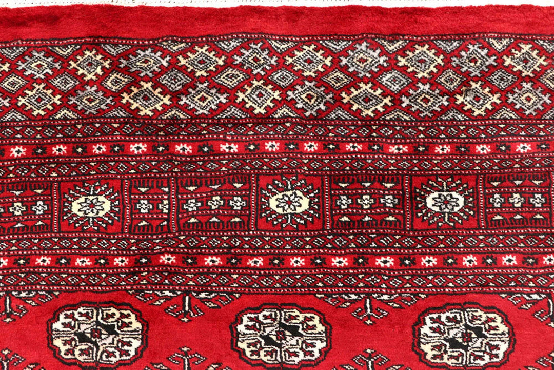 Red Pakistani Bokhara Rug 6' 1" x 9' 2" Hand-Knotted | No. QA77231