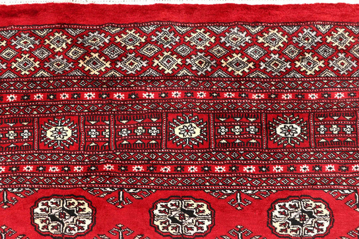 Red Pakistani Bokhara Rug 6' 1" x 9' 2" Hand-Knotted | No. QA77231