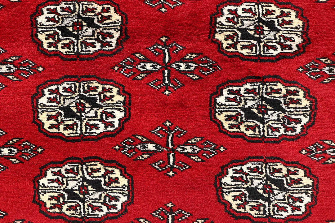Red Pakistani Bokhara Rug 6' 1" x 9' 2" Hand-Knotted | No. QA77231