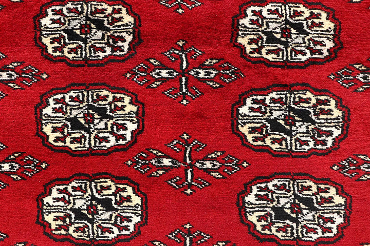 Red Pakistani Bokhara Rug 6' 1" x 9' 2" Hand-Knotted | No. QA77231