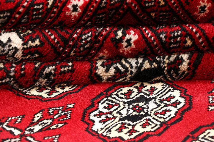 Red Pakistani Bokhara Rug 6' 1" x 9' 2" Hand-Knotted | No. QA77231