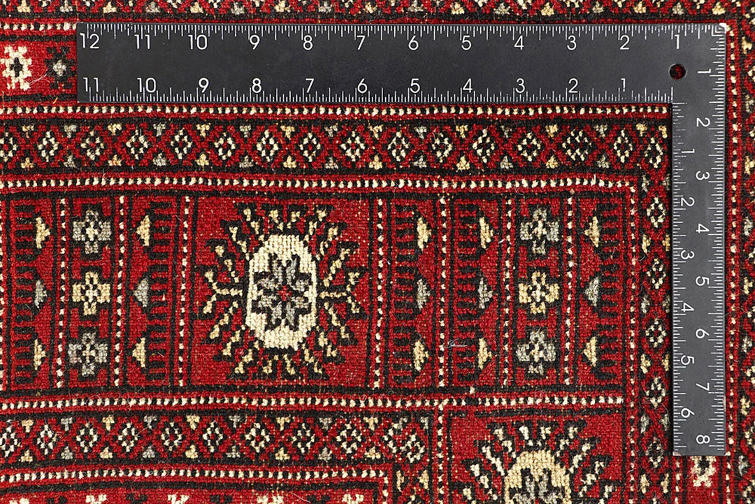 Red Pakistani Bokhara Rug 6' 1" x 9' 2" Hand-Knotted | No. QA77231
