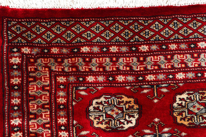 Dark Red Pakistani Bokhara Rug 2' 7" x 9' 7" Hand-Knotted | No. QA77272