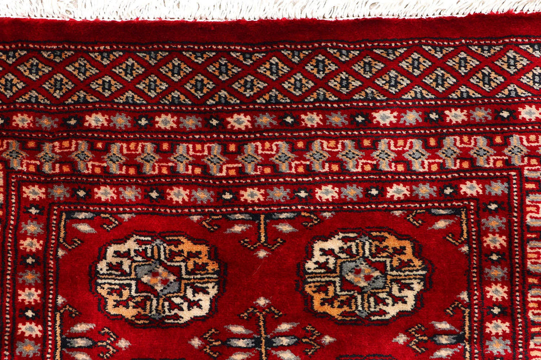 Dark Red Pakistani Bokhara Rug 2' 7" x 9' 7" Hand-Knotted | No. QA77272