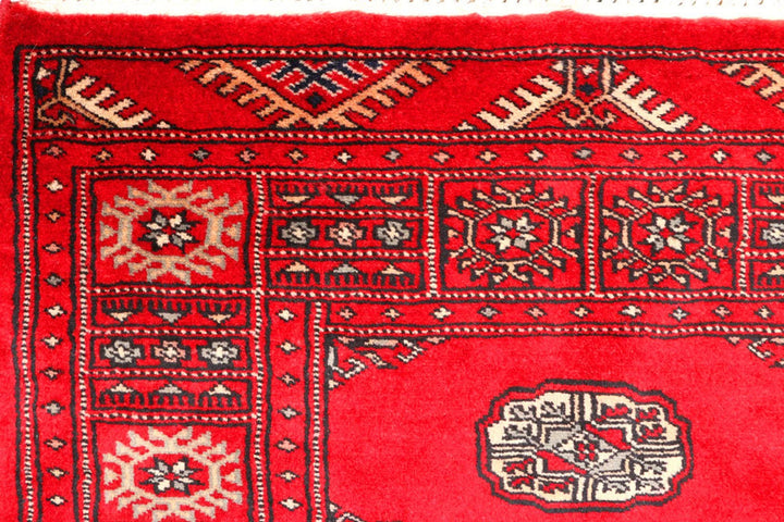 Red Pakistani Bokhara Rug 2' 7" x 9' 4" Hand-Knotted | No. QA78170